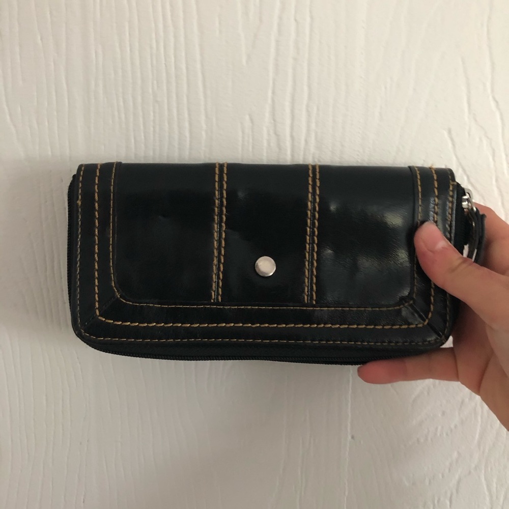 black wallet with tan stitching